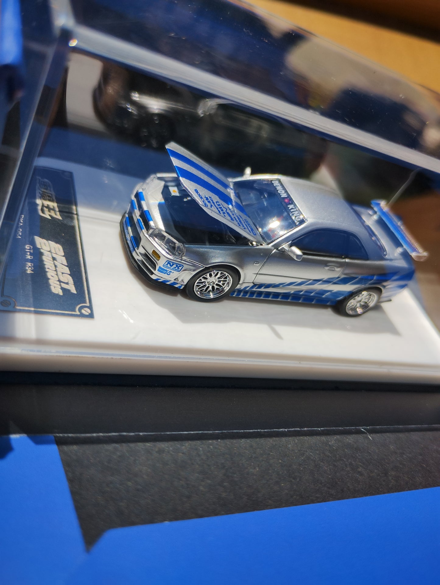 Demon King Auto 1:64 Nissan Skyline GTR R34 Silver Blue with Stripes *Open Unsealed*